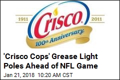 &#39;Crisco Cops&#39; Grease Light Poles Ahead of NFL Game