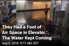 In Flooded Elevator: 2 Men, 6 Feet of Water