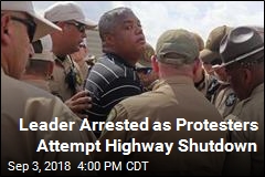 Leader Arrested as Protesters Attempt Highway Shutdown