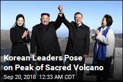 Kim, Moon Join Hands on Sacred Volcano