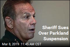 Suspended Over Parkland, Sheriff Sues