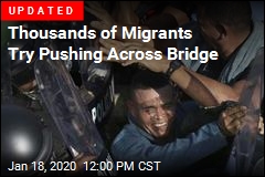 Over 1K Migrants Fill Bridge