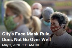 After Threats, City Kills Face Mask Rule