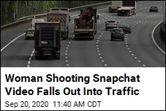 Woman Shooting Snapchat Video Falls Out Into Traffic
