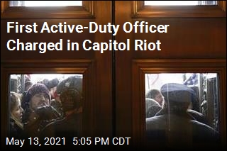 Marine Officer Charged With Breaching Capitol Doors