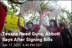With NRA Boss, Abbott Signs Laws Easing Gun Rules
