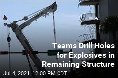 Teams Drill Holes for Explosives in Remaining Structure