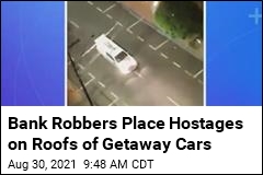 Bank Robbers Strap Hostages to Roofs of Getaway Cars