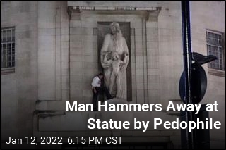 Man Hammers Away at Statue by Pedophile