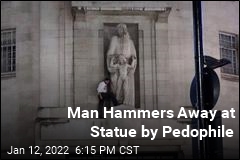 Man Hammers Away at Statue by Pedophile