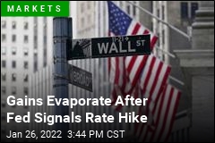 Stocks Give Up Gains After Fed Signals Rate Hike