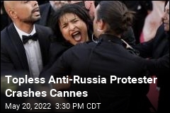 Topless Anti-Russia Protester Crashes Cannes