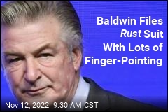 Baldwin Files Rust Suit With Lots of Finger-Pointing