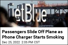 Passengers Slide Off Plane as Phone Charger Starts Smoking