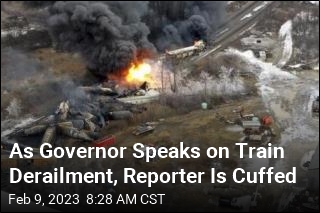 As Governor Speaks on Train Derailment, Reporter Is Cuffed