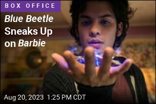 Blue Beetle Sneaks Up on Barbie