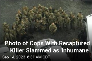 Photo of Cops With Recaptured Killer Slammed as &#39;Inhumane&#39;