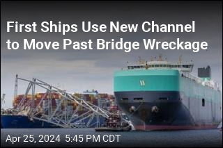 First Ships Use New Channel to Move Past Bridge Wreckage