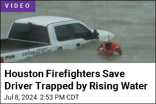 Houston Firefighters Save Driver Trapped by Rising Water