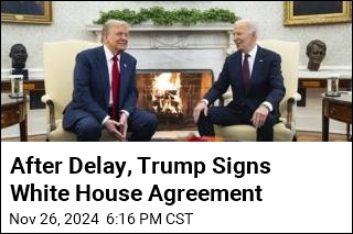 After Delay, Trump Signs White House Agreement