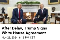 After Delay, Trump Signs White House Agreement