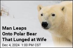 Man Leaps Onto Polar Bear to Protect His Wife