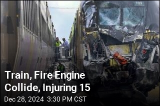 Train, Fire Engine Collide, Injuring 15