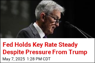 Fed Holds Key Rate Steady Despite Pressure From Trump