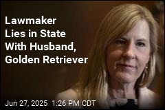 Lawmaker Lies in State With Husband, Dog