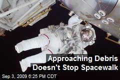 Approaching Debris Doesn't Stop Spacewalk