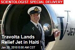 Travolta Lands Relief Jet in Haiti